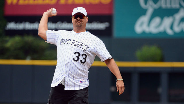 DENVER, CO - JUNE 30: Former Colorado Rockies player Larry Walker throws the ceremonial first pitch prior to the game against the San Francisco Giants at Coors Field on June 30, 2013 in Denver, Colorado.