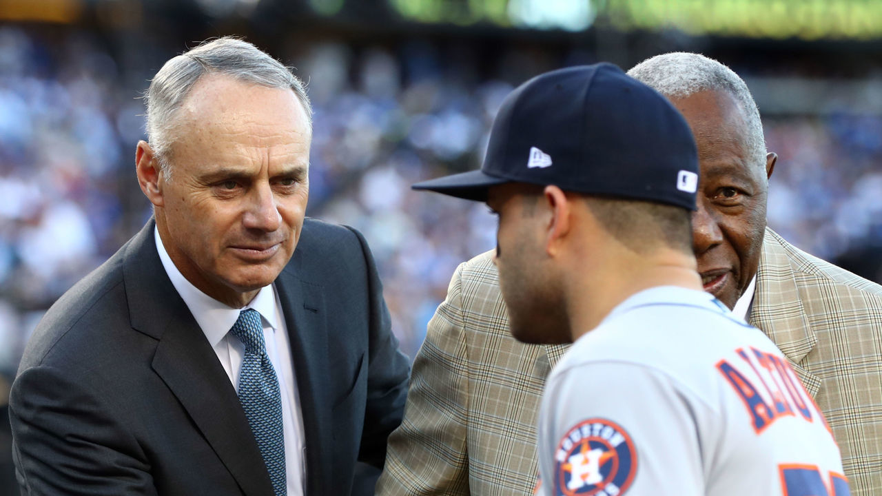 LOS ANGELES, CA - OCTOBER 25: Major League Baseball Commissioner Robert D. Manfred Jr. and Hall of Famer Hank Aaron shake hands with 2017 Hank Aaron Award winner Jose Altuve #27 of the Houston Astros before Game 2 of the 2017 World Series against the Los Angeles Dodgers at Dodger Stadium on Wednesday, October 25, 2017 in Los Angeles, California.