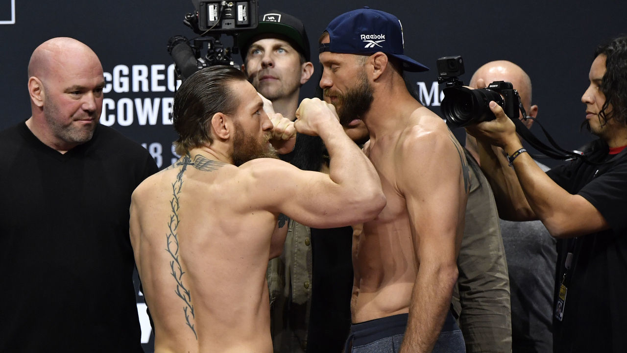 LAS VEGAS, NEVADA - JANUARY 17: (L-R) Conor McGregor of Ireland and Donald Cerrone face off during the UFC 246 weigh-in at Park Theater at Park MGM on January 17, 2020 in Las Vegas, Nevada.