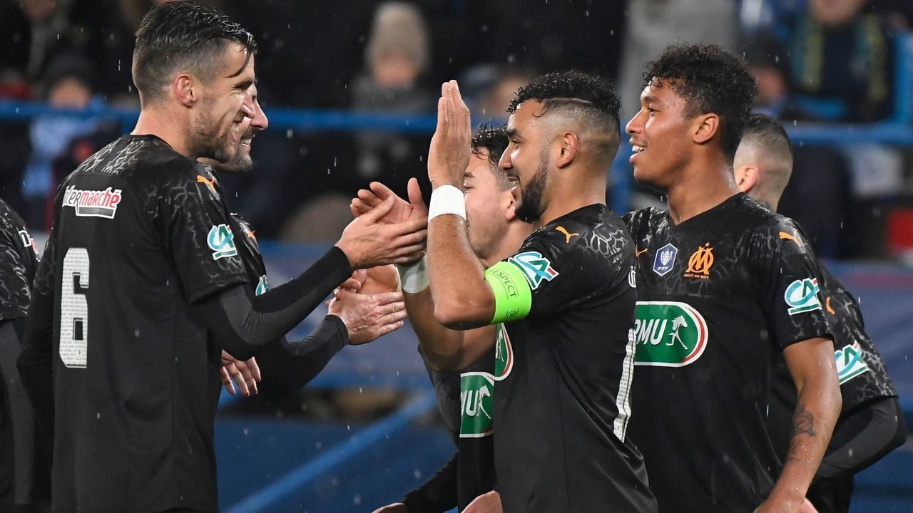 Marseille's French midfielder Dimitri Payet (C) celebrates after scoring during the French Cup football match US Granville vs Olympique de Marseille at the Michel-d'Ornano stadium in Caen on January 17, 2020.