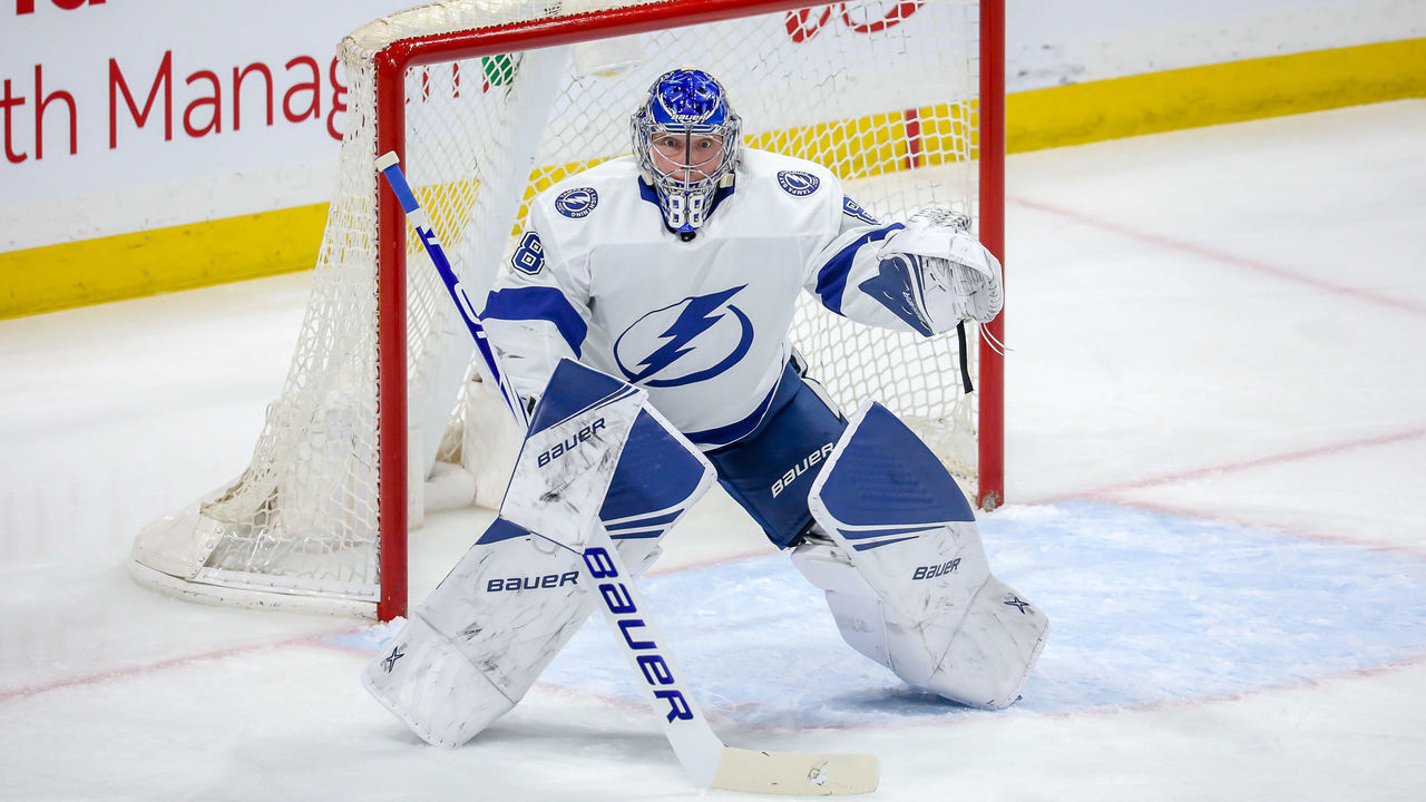 WINNIPEG, MB - JANUARY 17: Goaltender Andrei Vasilevskiy #88 of the Tampa Bay Lightning keeps an eye on the play during first period action against the Winnipeg Jets at the Bell MTS Place on January 17, 2020 in Winnipeg, Manitoba, Canada.
