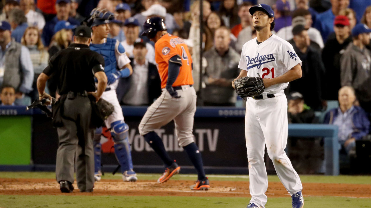 LOS ANGELES, CA - NOVEMBER 01: Yu Darvish #21 of the Los Angeles Dodgers reacts after George Springer #4 of the Houston Astros hit a two-run home run during the second inning in game seven of the 2017 World Series at Dodger Stadium on November 1, 2017 in Los Angeles, California.