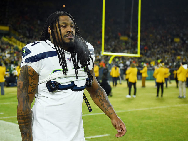 GREEN BAY, WISCONSIN - JANUARY 12: Marshawn Lynch #24 of the Seattle Seahawks looks on before the NFC Divisional Playoff game against the Green Bay Packers at Lambeau Field on January 12, 2020 in Green Bay, Wisconsin.