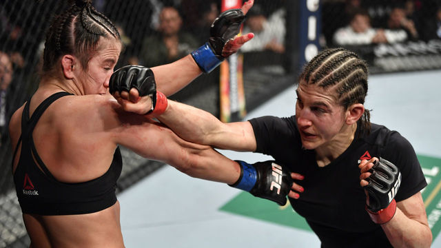 LAS VEGAS, NEVADA - JANUARY 18: (R-L) Roxanne Modafferi punches Maycee Barber in their flyweight fight during the UFC 246 event at T-Mobile Arena on January 18, 2020 in Las Vegas, Nevada.