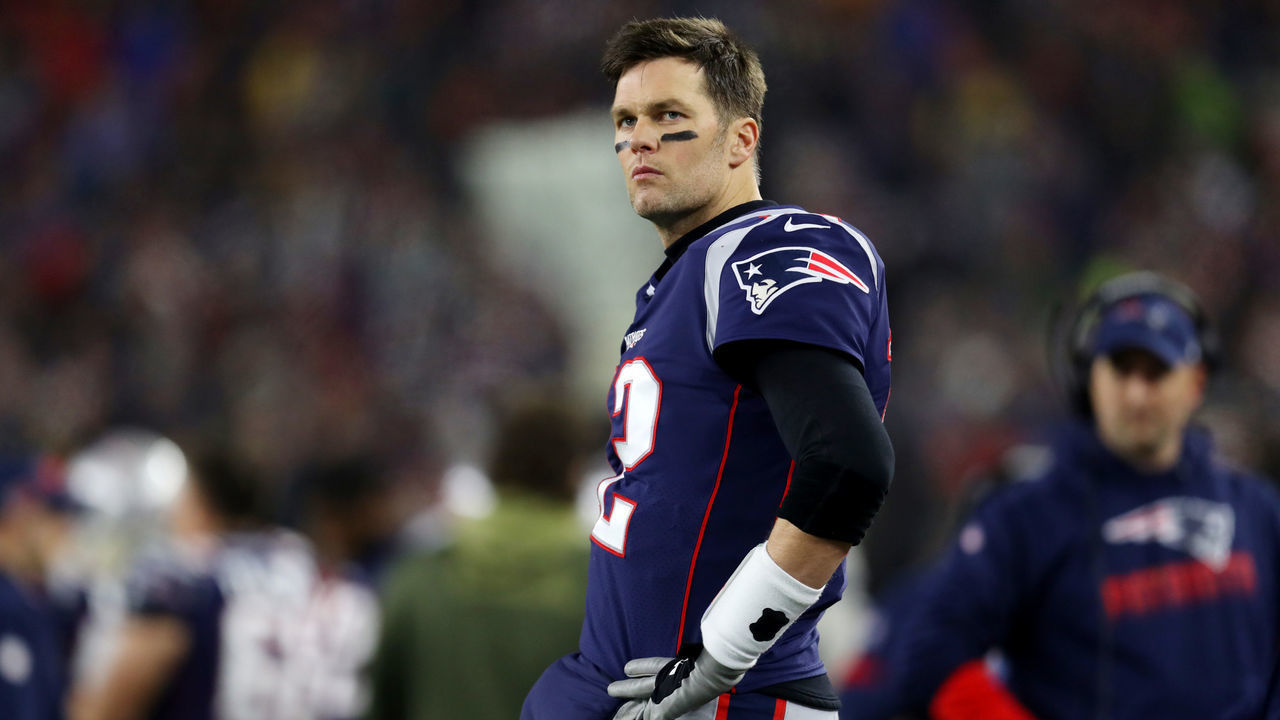 FOXBOROUGH, MASSACHUSETTS - JANUARY 04: Tom Brady #12 of the New England Patriots looks on from the sideline during the the AFC Wild Card Playoff game against the Tennessee Titans at Gillette Stadium on January 04, 2020 in Foxborough, Massachusetts.