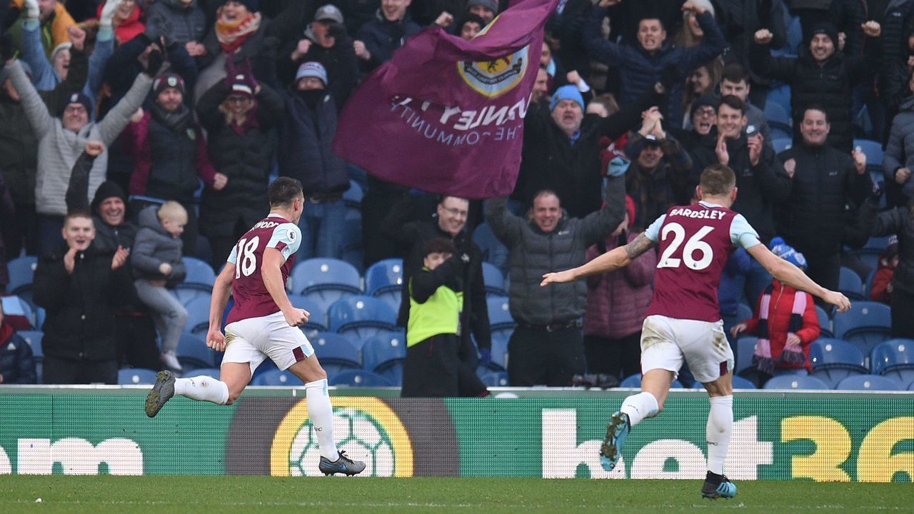 Burnley's English midfielder Ashley Westwood (L) celebrates scoring their second goal during the English Premier League football match between Burnley and Leicester City at Turf Moor in Burnley, north west England on January 19, 2020.