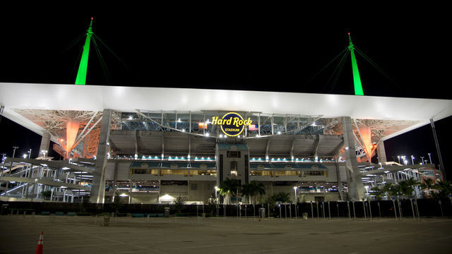 MIAMI GARDENS, FL - SEPTEMBER 08: Exterior view of the Hard Rock Stadium lit up with the green and orange colors of the University of Miami after the college football game between the Savannah State Tigers and the University of Miami Hurricanes on September 8, 2018 at the Hard Rock Stadium in Miami Gardens, FL.