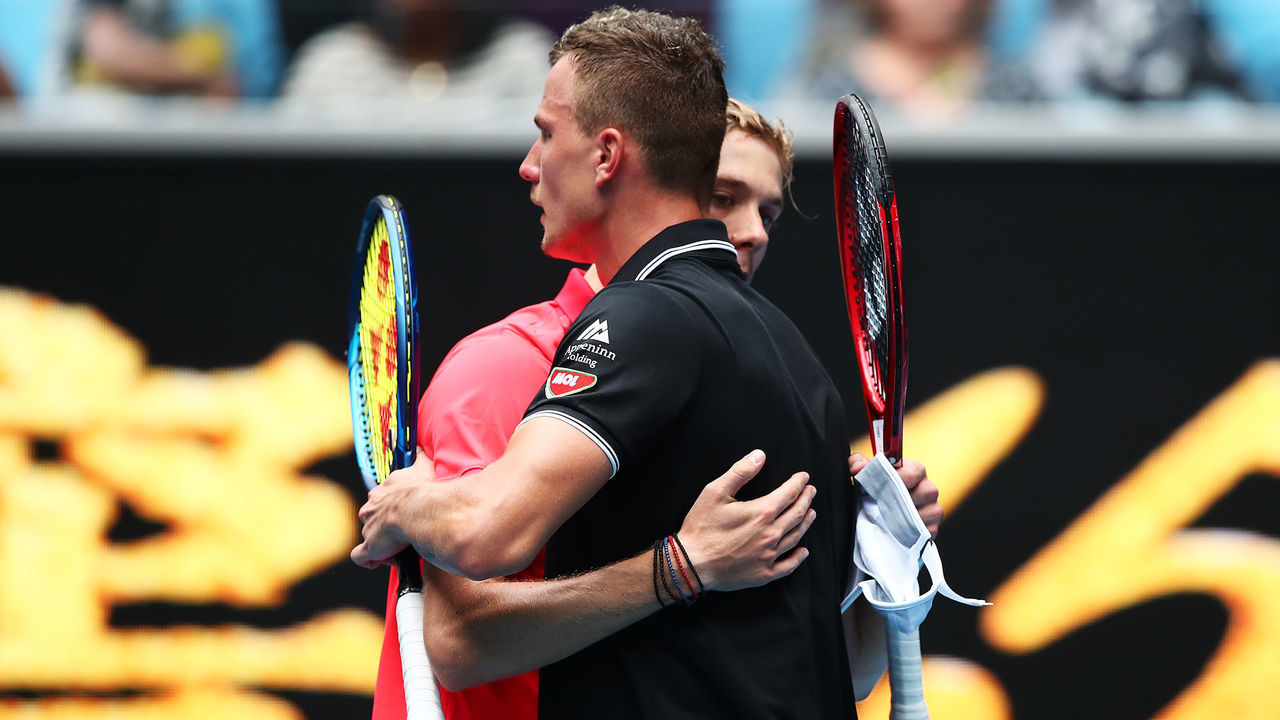 MELBOURNE, AUSTRALIA - JANUARY 20: Denis Shapovalov of Canada hugs Marton Fucsovics of Hungary following their Men's Singles first round match on day one of the 2020 Australian Open at Melbourne Park on January 20, 2020 in Melbourne, Australia.