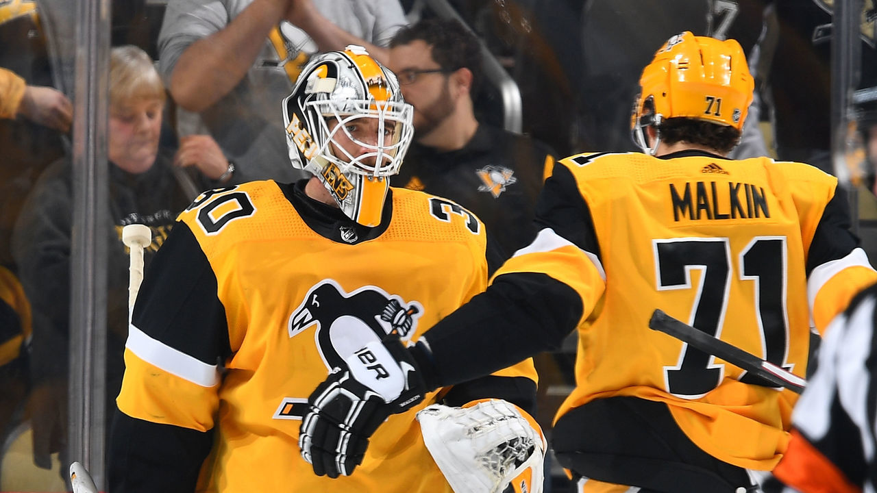 PITTSBURGH, PA - MARCH 07: Matt Murray #30 of the Pittsburgh Penguins celebrates with Evgeni Malkin #71 after a 3-0 win over the Columbus Blue Jackets at PPG Paints Arena on March 7, 2019 in Pittsburgh, Pennsylvania.