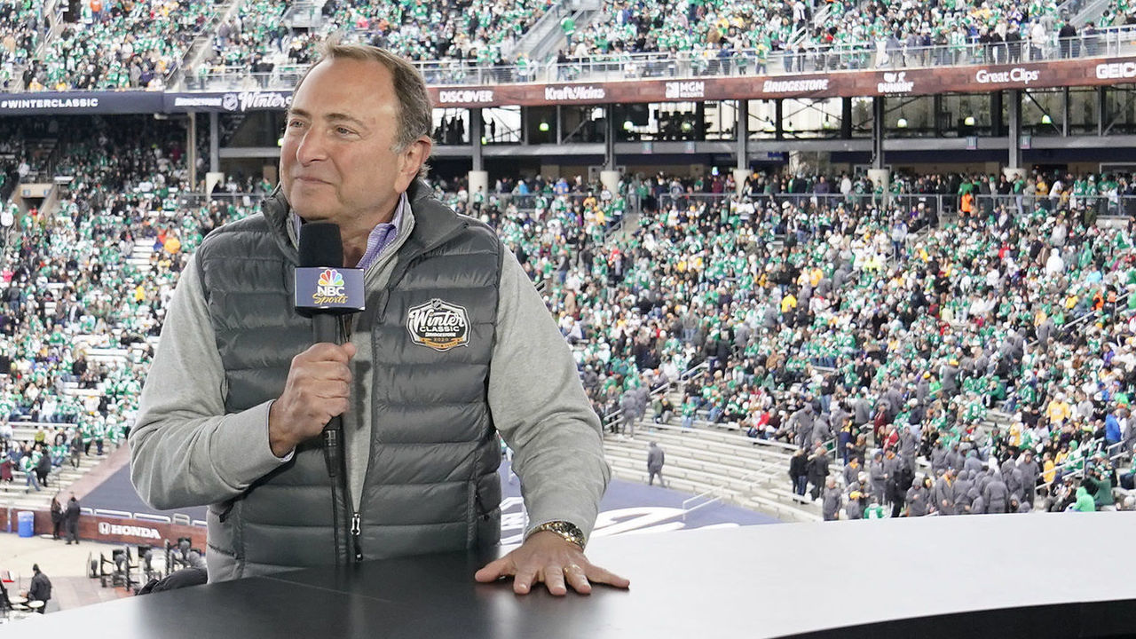 DALLAS, TEXAS - JANUARY 01: NBC Sportscaster Mike Tirico speaks with NHL Commisioner Gary Bettman during the second intermission of the 2020 NHL Winter Classic between the Nashville Predators and the Dallas Stars at Cotton Bowl on January 01, 2020 in Dallas, Texas.