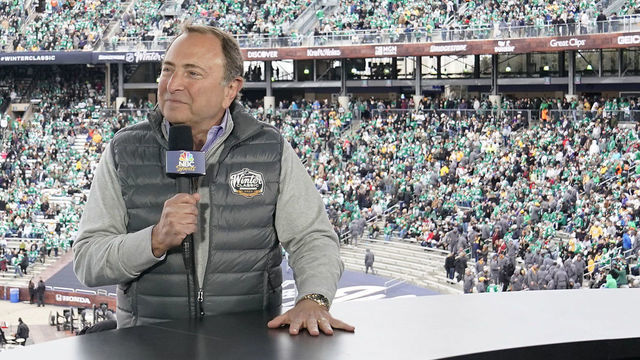 DALLAS, TEXAS - JANUARY 01: NBC Sportscaster Mike Tirico speaks with NHL Commisioner Gary Bettman during the second intermission of the 2020 NHL Winter Classic between the Nashville Predators and the Dallas Stars at Cotton Bowl on January 01, 2020 in Dallas, Texas.