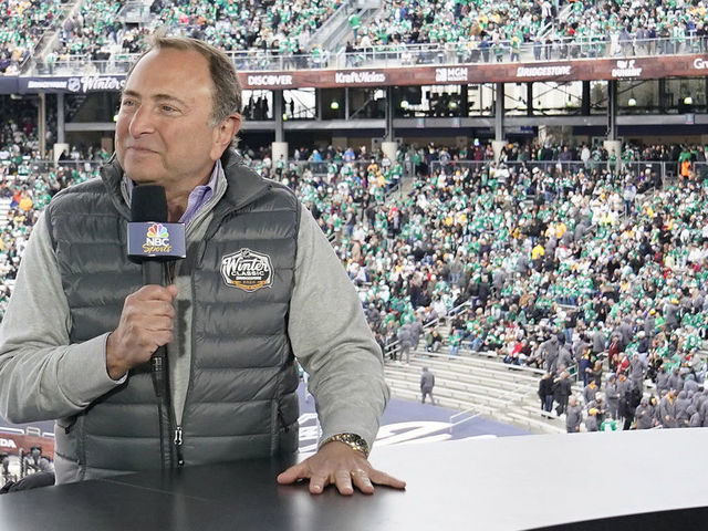 DALLAS, TEXAS - JANUARY 01: NBC Sportscaster Mike Tirico speaks with NHL Commisioner Gary Bettman during the second intermission of the 2020 NHL Winter Classic between the Nashville Predators and the Dallas Stars at Cotton Bowl on January 01, 2020 in Dallas, Texas.