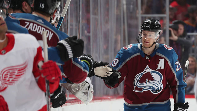 DENVER, COLORADO - JANUARY 20: Nathan Mackinnon #29 of the Colorado Avalanche celebrates a goal against the Detroit Red Wings with his bench at Pepsi Center on January 20, 2020 in Denver, Colorado.