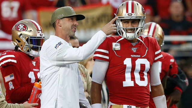 SANTA CLARA, CALIFORNIA - NOVEMBER 11: Head coach Kyle Shanahan of the San Francisco 49ers shares a laugh with quarterback Jimmy Garoppolo #10 before the game against the Seattle Seahawks at Levi's Stadium on November 11, 2019 in Santa Clara, California.