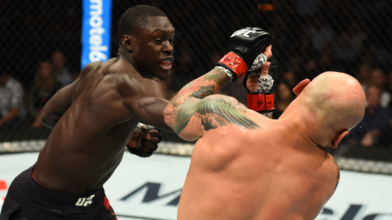 AUSTIN, TX - FEBRUARY 18: Curtis Millender (L) punches Thiago Alves of Brazil in their welterweight bout during the UFC Fight Night event at Frank Erwin Center on February 18, 2018 in Austin, Texas.