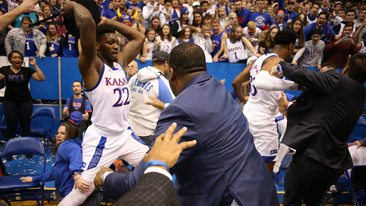 LAWRENCE, KANSAS - JANUARY 21: Silvio De Sousa #22 of the Kansas Jayhawks picks up a chair during a brawl as the game against the Kansas State Wildcats ends at Allen Fieldhouse on January 21, 2020 in Lawrence, Kansas.