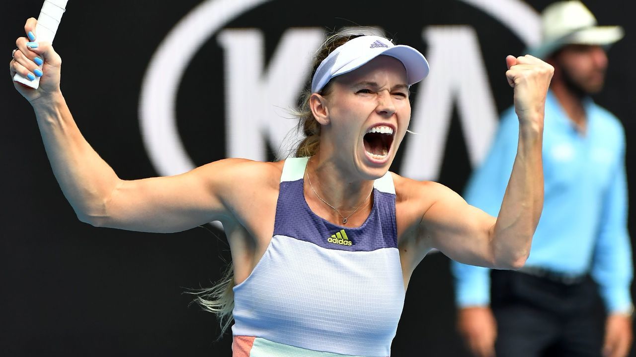 Denmark's Caroline Wozniacki celebrates victory against Ukraine's Dayana Yastremska during their women's singles match on day three of the Australian Open tennis tournament in Melbourne on January 22, 2020.