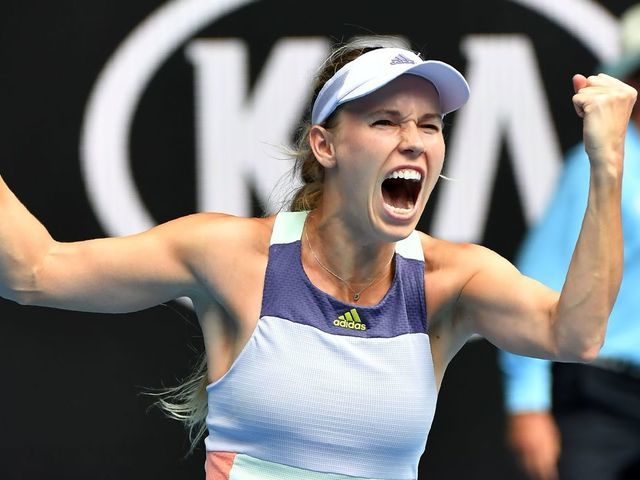 Denmark's Caroline Wozniacki celebrates victory against Ukraine's Dayana Yastremska during their women's singles match on day three of the Australian Open tennis tournament in Melbourne on January 22, 2020.