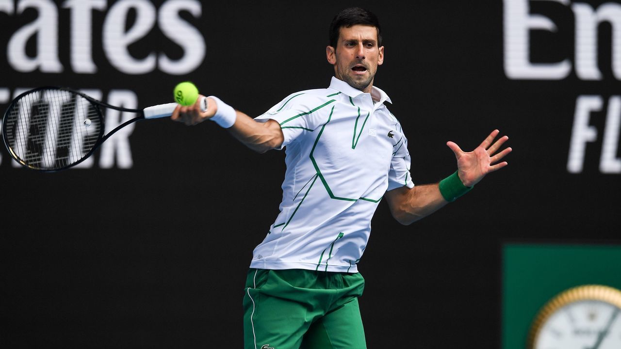 Serbia's Novak Djokovic hits a return against Japan's Tatsuma Ito during their men's singles match on day three of the Australian Open tennis tournament in Melbourne on January 22, 2020.