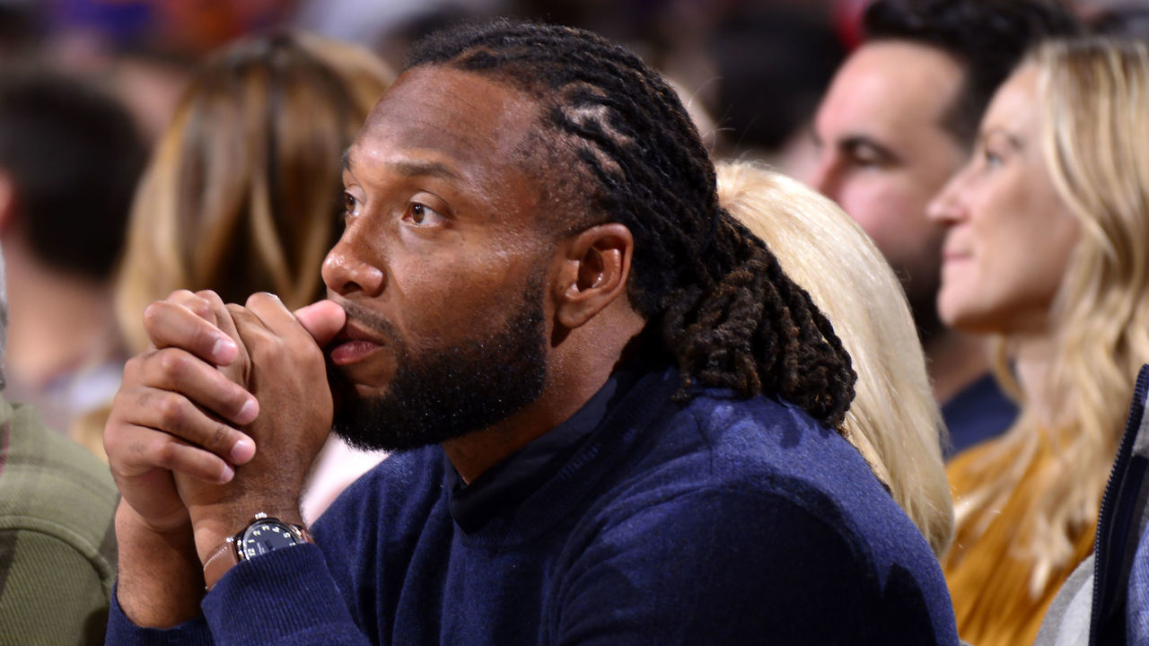 PHOENIX, AZ - NOVEMBER 29: Cardinals football player, Larry Fitzgerald attends a game between the Phoenix Suns and the Dallas Mavericks on November 29, 2019 at Talking Stick Resort Arena in Phoenix, Arizona. Mandatory Copyright Notice: Copyright 2019 NBAE