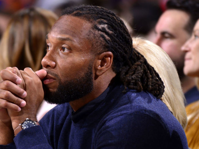 PHOENIX, AZ - NOVEMBER 29: Cardinals football player, Larry Fitzgerald attends a game between the Phoenix Suns and the Dallas Mavericks on November 29, 2019 at Talking Stick Resort Arena in Phoenix, Arizona. Mandatory Copyright Notice: Copyright 2019 NBAE