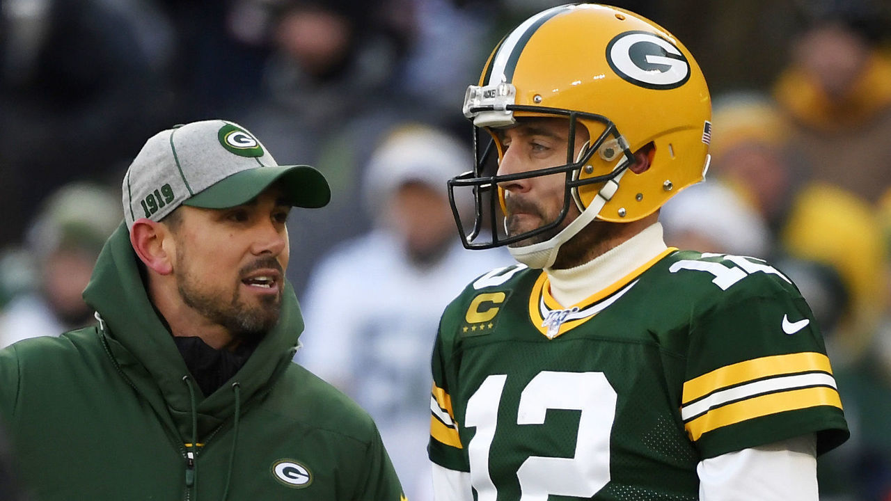 GREEN BAY, WISCONSIN - DECEMBER 15: head coach Matt LaFleur of the Green Bay Packers discusses with Aaron Rodgers #12 of the Green Bay Packers during warms up before the game against the Chicago Bears at Lambeau Field on December 15, 2019 in Green Bay, Wisconsin.
