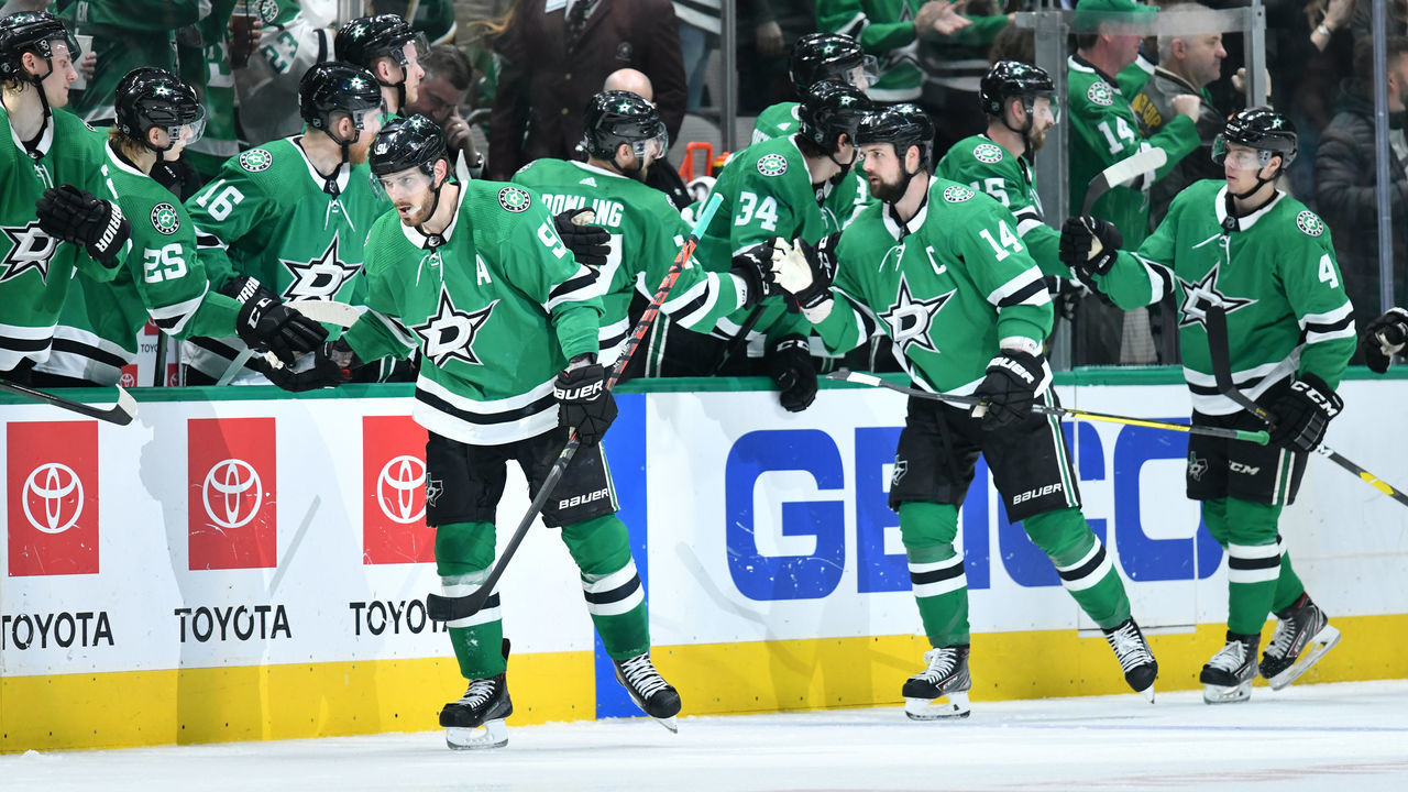 DALLAS, TX - JANUARY 16: Tyler Seguin #91, Jamie Benn #14, Miro Heiskanen #4 and the Dallas Stars celebrate a goal against the Buffalo Sabres at the American Airlines Center on January 16, 2019 in Dallas, Texas.