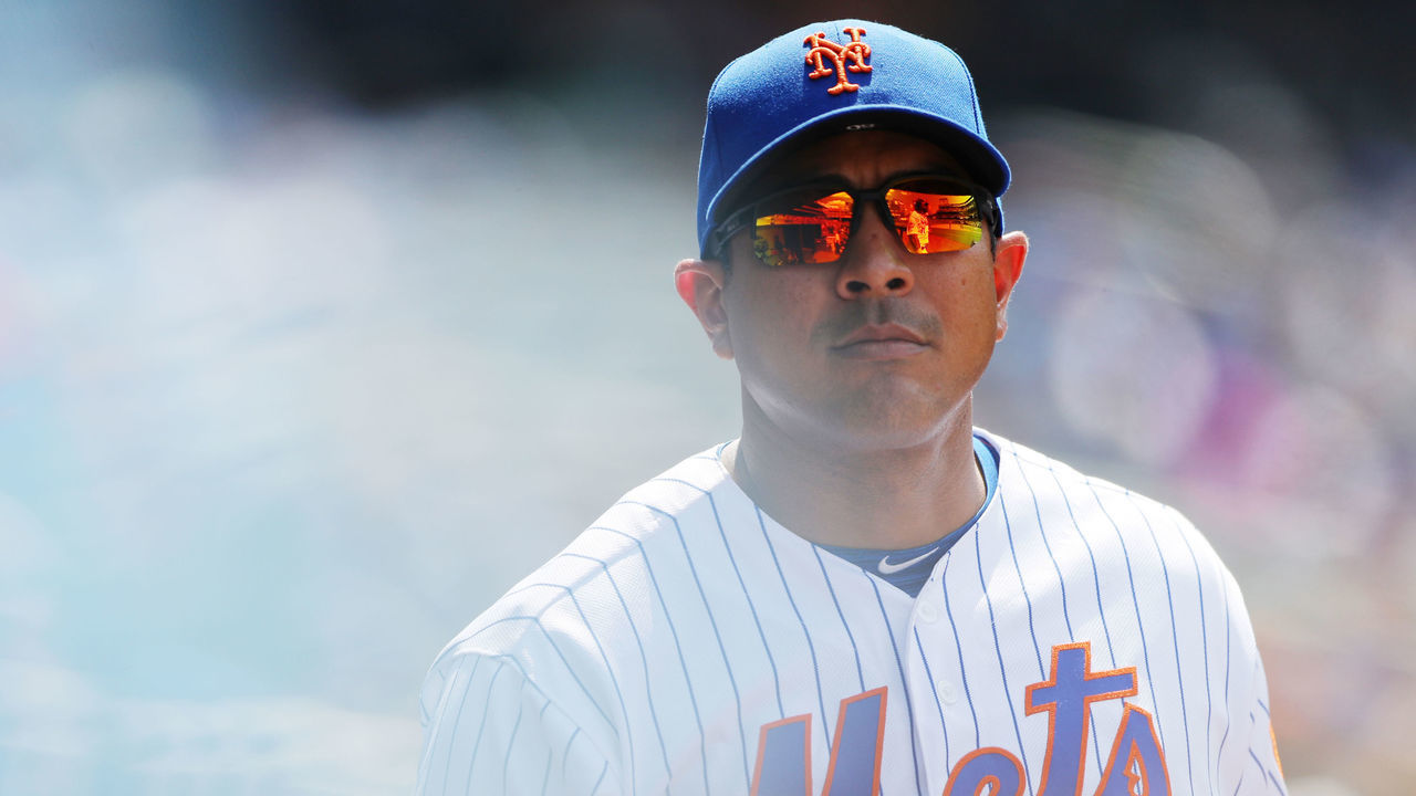 FLUSHING, NY - JULY 25: Quality control coach Luis Rojas looks on from the dugout during the game between the San Diego Padres and the New York Mets at Citi Field on Thursday, July 25, 2019 in Flushing, New York.