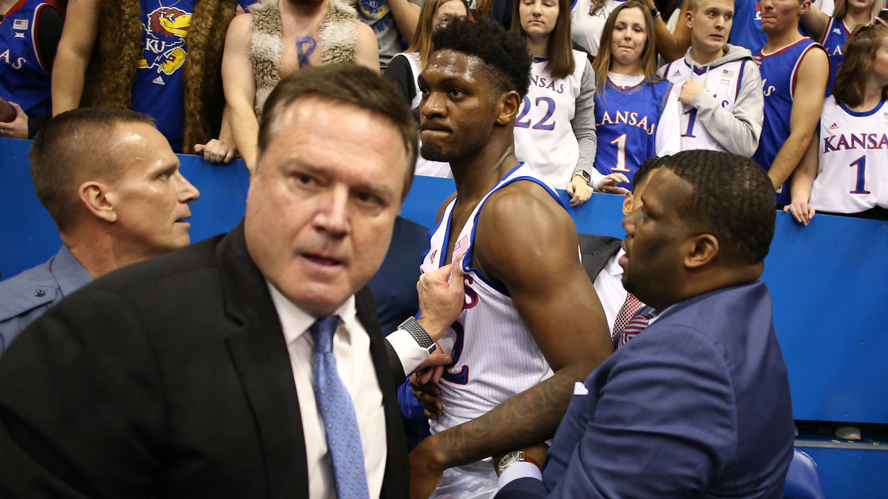 LAWRENCE, KANSAS - JANUARY 21: Head coach Bill Self of the Kansas Jayhawks holds back Silvio De Sousa #22 of the Kansas Jayhawks during a brawl as the game against the Kansas State Wildcats ends at Allen Fieldhouse on January 21, 2020 in Lawrence, Kansas.