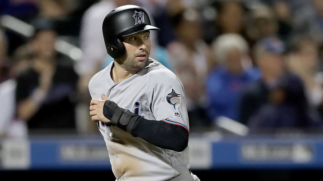 NEW YORK, NEW YORK - SEPTEMBER 24: Neil Walker #18 of the Miami Marlins scores on a single from teammate Jorge Alfaro of the Miami Marlins in the fifth inning against the New York Mets at Citi Field on September 24, 2019 in the Flushing neighborhood of the Queens borough of New York City.