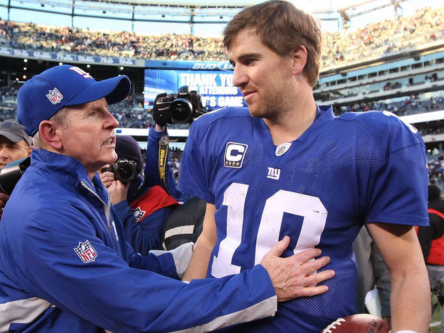 EAST RUTHERFORD, NJ - NOVEMBER 28: Eli Manning #10 of the New York Giants is met by Giants Head Coach Tom Coughlin after their 24-20 win against the Jacksonville Jaguars on November 28, 2010 at The New Meadowlands Stadium in East Rutherford, New Jersey.
