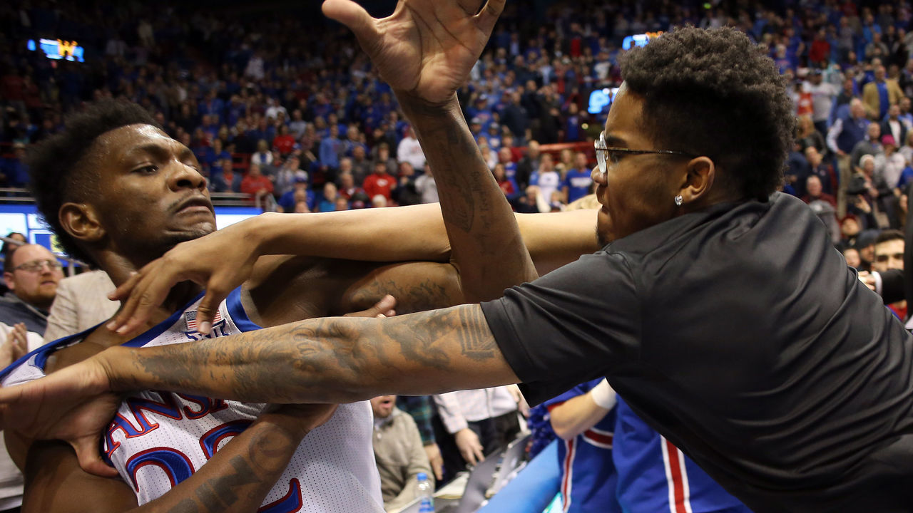 LAWRENCE, KANSAS - JANUARY 21: Silvio De Sousa #22 of the Kansas Jayhawks and James Love III of the Kansas State Wildcats exchange blows during a brawl after the game at Allen Fieldhouse on January 21, 2020 in Lawrence, Kansas.