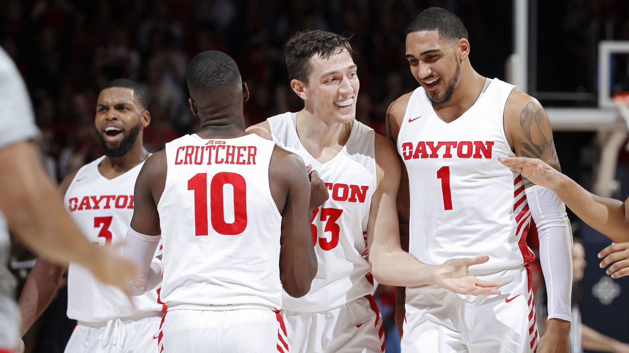 DAYTON, OH - JANUARY 22: Ryan Mikesell #33 of the Dayton Flyers celebrates with Obi Toppin #1 and Jalen Crutcher #10 in the first half of the game against the St. Bonaventure Bonnies at UD Arena on January 22, 2020 in Dayton, Ohio.