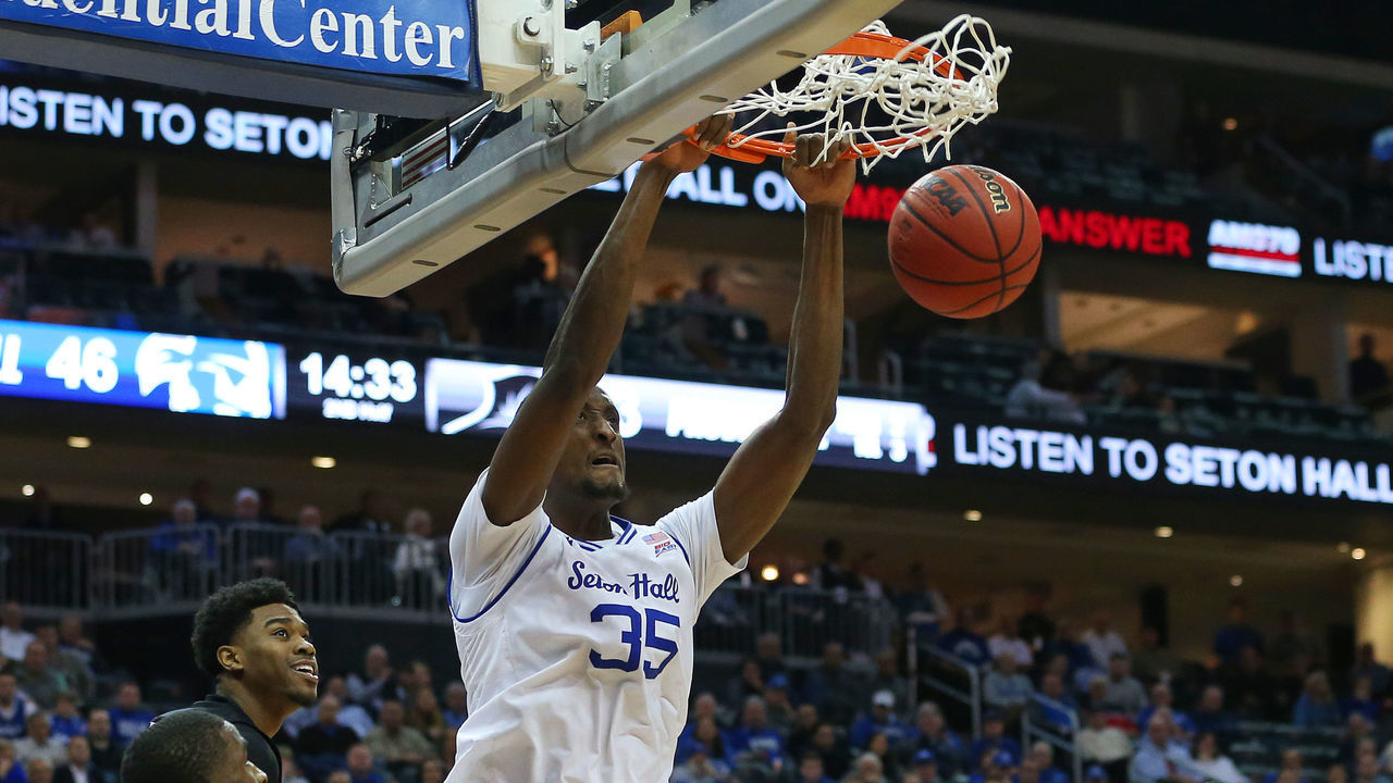 NEWARK, NJ - JANUARY 22: Romaro Gill #35 of the Seton Hall Pirates dunks between Alpha Diallo #11 and Kalif Young #13 of the Providence Friars during the second half of a college basketball game at Prudential Center on January 22, 2020 in Newark, New Jersey. Seton Hall defeated Providence 73-64.