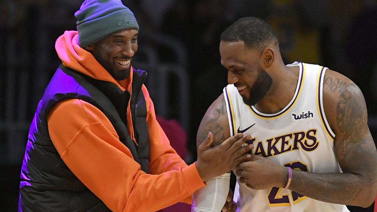LOS ANGELES, CA - DECEMBER 29: LeBron James #23 of the Los Angeles Lakers has a moment on the sideline with former Laker Kobe Bryant in the second half during a game against the Dallas Mavericks at Staples Center on December 29, 2019 in Los Angeles, California. NOTE TO USER: User expressly acknowledges and agrees that, by downloading and/or using this photograph, user is consenting to the terms and conditions of the Getty Images License Agreement.