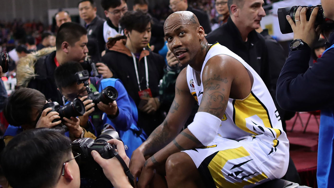 Former NBA player Stephon Marbury looks on after his final game for the Chinese Basketball Association's Beijing Fly Dragons in Beijing on February 11, 2018. Marbury retired from pro basketball on February 11, 2018 after a 22-year career. / AFP PHOTO / - / China OUT