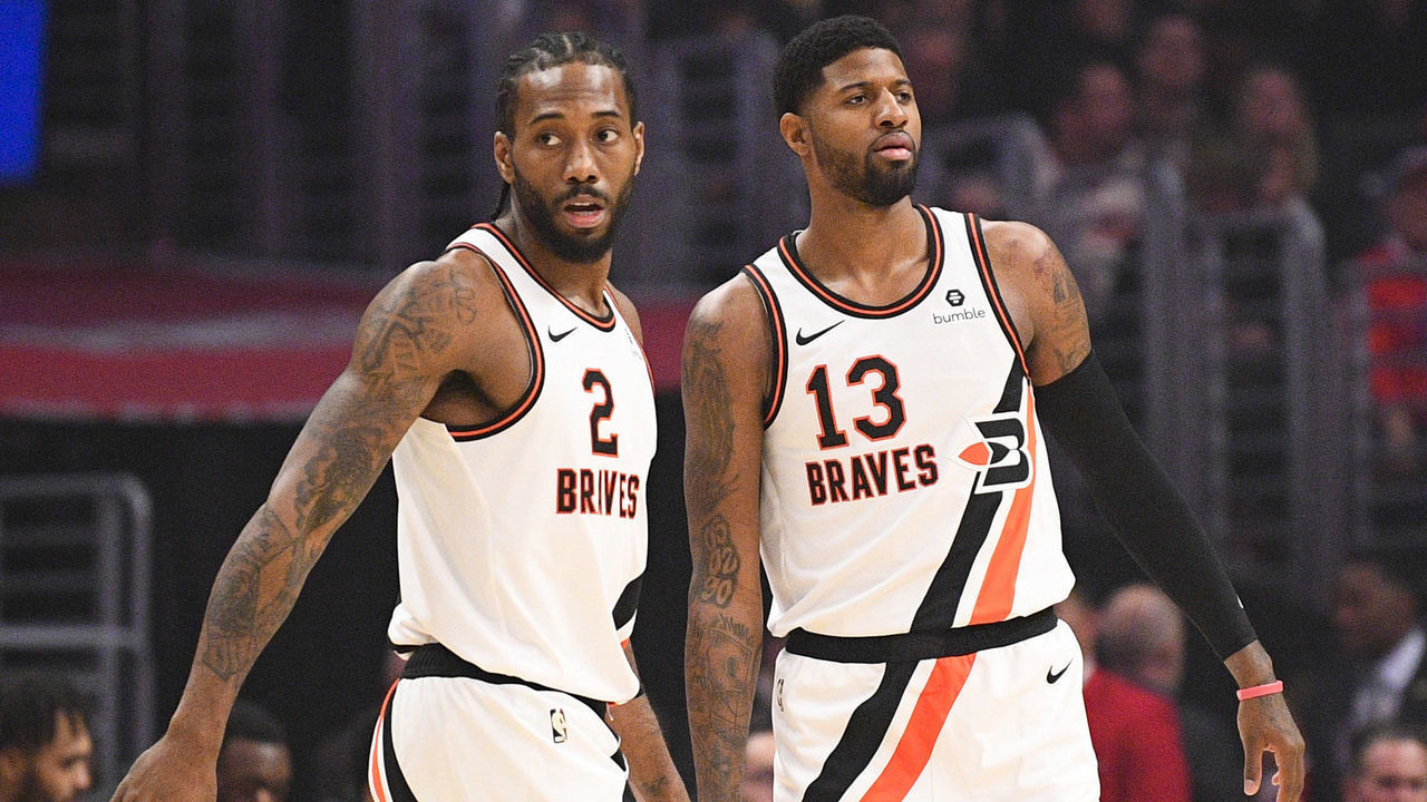 LOS ANGELES, CA - DECEMBER 03: Los Angeles Clippers Forward Kawhi Leonard (2) and Los Angeles Clippers Guard Paul George (13) give each other a high five during a NBA game between the Portland Trail Blazers and the Los Angeles Clippers on December 3, 2019 at STAPLES Center in Los Angeles, CA.