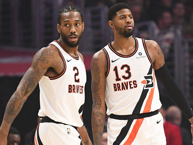 LOS ANGELES, CA - DECEMBER 03: Los Angeles Clippers Forward Kawhi Leonard (2) and Los Angeles Clippers Guard Paul George (13) give each other a high five during a NBA game between the Portland Trail Blazers and the Los Angeles Clippers on December 3, 2019 at STAPLES Center in Los Angeles, CA.