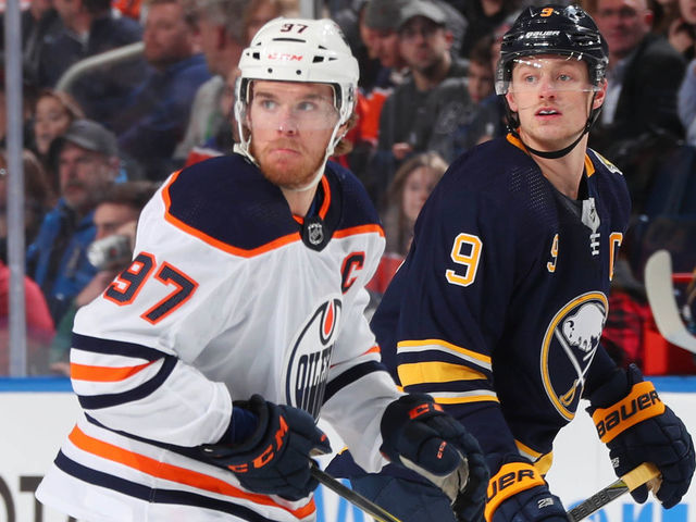 BUFFALO, NY - JANUARY 2: Connor McDavid #97 of the Edmonton Oilers skates against Jack Eichel #9 of the Buffalo Sabres during an NHL game on January 2, 2020 at KeyBank Center in Buffalo, New York.
