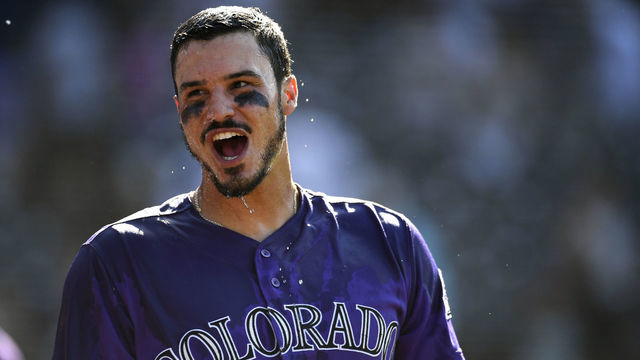 DENVER, CO - AUGUST 14: Nolan Arenado smiles after getting doused with water after his walk off two run home run against the Arizona Diamondbacks in the 9th inning at Coors Field on August 14, 2019 in Denver, Colorado. The Rockies beat the Diamondbacks 7-6.