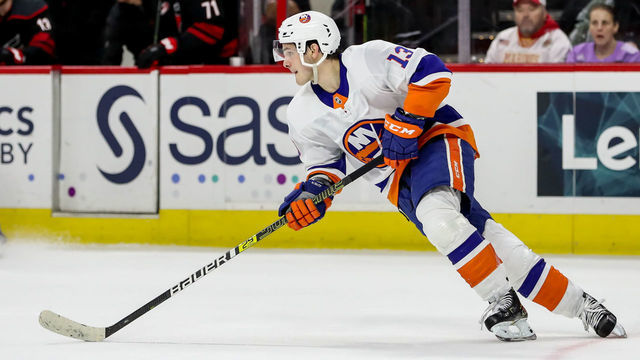 RALEIGH, NC - JANUARY 19: New York Islanders Center Mathew Barzal (13) heads up ice with the puck during an NHL game between the Carolina Hurricanes and New York Islanders on January 19, 2020 at the PNC Arena in Raleigh, NC.