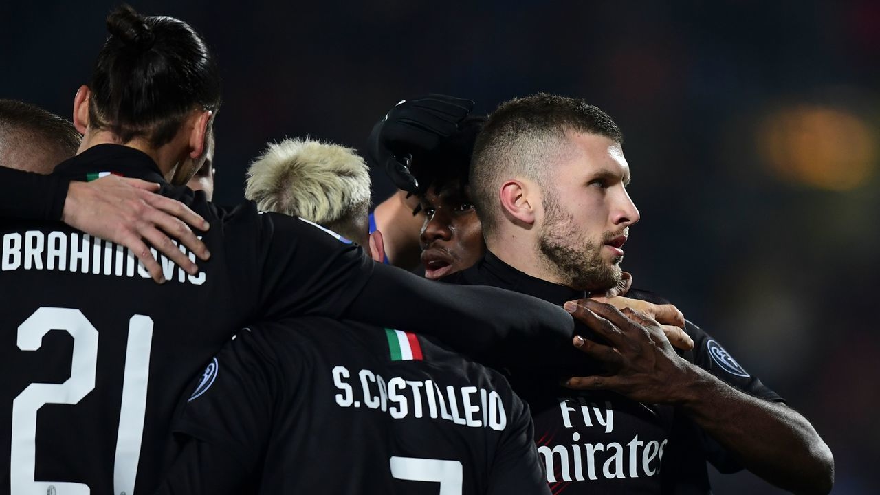 AC Milan's Croatian forward Ante Rebic (R) celebrates after scoring his team's first goal during the Italian Serie A football match between Brescia and AC Milan on January 24, 2020 at the Mario Rigamonti stadium in Brescia.