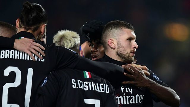 AC Milan's Croatian forward Ante Rebic (R) celebrates after scoring his team's first goal during the Italian Serie A football match between Brescia and AC Milan on January 24, 2020 at the Mario Rigamonti stadium in Brescia.