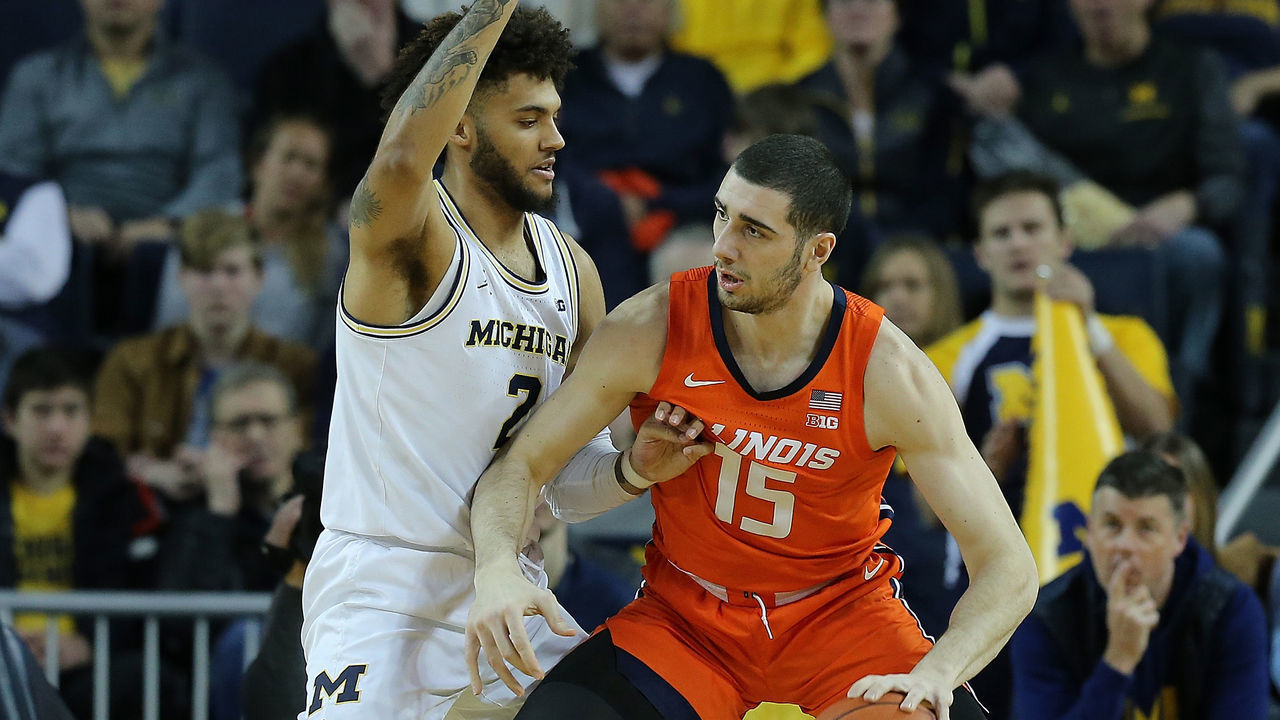 ANN ARBOR, MI - JANUARY 25: Giorgi Bezhanishvili #15 of the Illinois Fighting Illini looks to drive the ball to the basket as Isaiah Livers #2 of the Michigan Wolverines defends during the first half of the game at Crisler Center on January 25, 2020 in Ann Arbor, Michigan.
