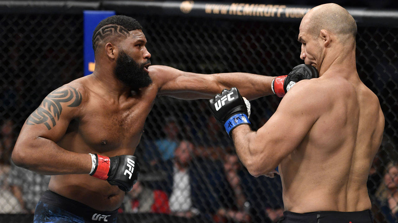 RALEIGH, NORTH CAROLINA - JANUARY 25: (L-R) Curtis Blaydes punches Junior Dos Santos of Brazil in their heavyweight fight during the UFC Fight Night event at PNC Arena on January 25, 2020 in Raleigh, North Carolina.