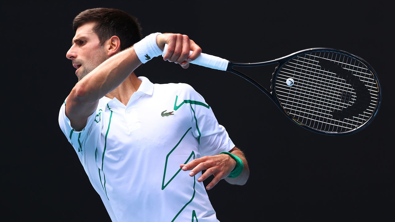 MELBOURNE, AUSTRALIA - JANUARY 26: Novak Djokovic of Serbia plays a shot during his Men's Singles fourth round match against Diego Schwartzman of Argentina on day seven of the 2020 Australian Open at Melbourne Park on January 26, 2020 in Melbourne, Australia.