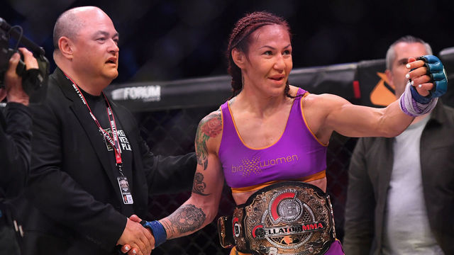 INGLEWOOD, CA - JANUARY 25: Cris Cyborg (blue gloves) is congratulated by Bellator president Scott Coker after defeating Julia Budd (not pictured) in their featherweight world title fight at The Forum on January 25, 2020 in Inglewood, California. Cyborg won by TKO in the 4th round.