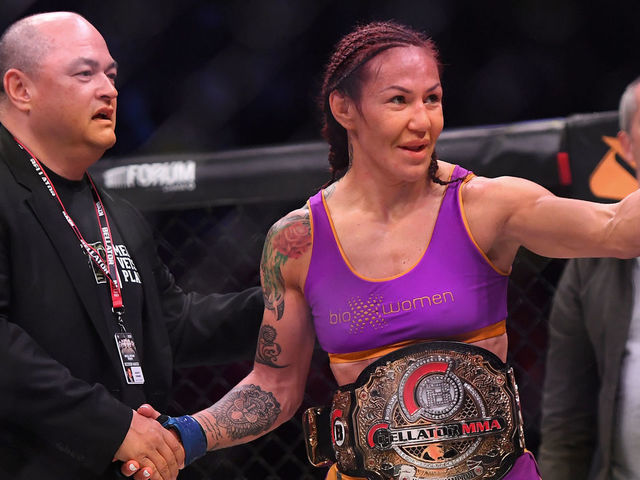INGLEWOOD, CA - JANUARY 25: Cris Cyborg (blue gloves) is congratulated by Bellator president Scott Coker after defeating Julia Budd (not pictured) in their featherweight world title fight at The Forum on January 25, 2020 in Inglewood, California. Cyborg won by TKO in the 4th round.
