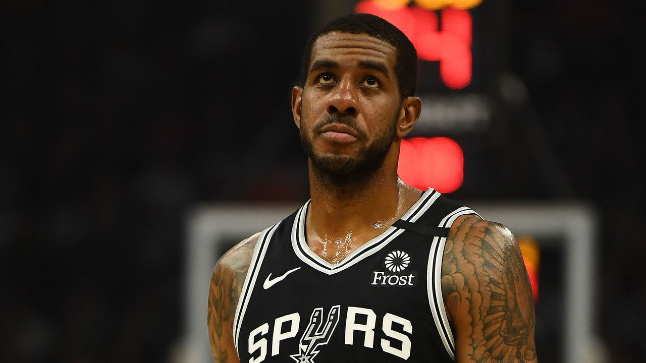 MILWAUKEE, WISCONSIN - JANUARY 04: LaMarcus Aldridge #12 of the San Antonio Spurs walks backcourt during a game against the Milwaukee Bucks at Fiserv Forum on January 04, 2020 in Milwaukee, Wisconsin.