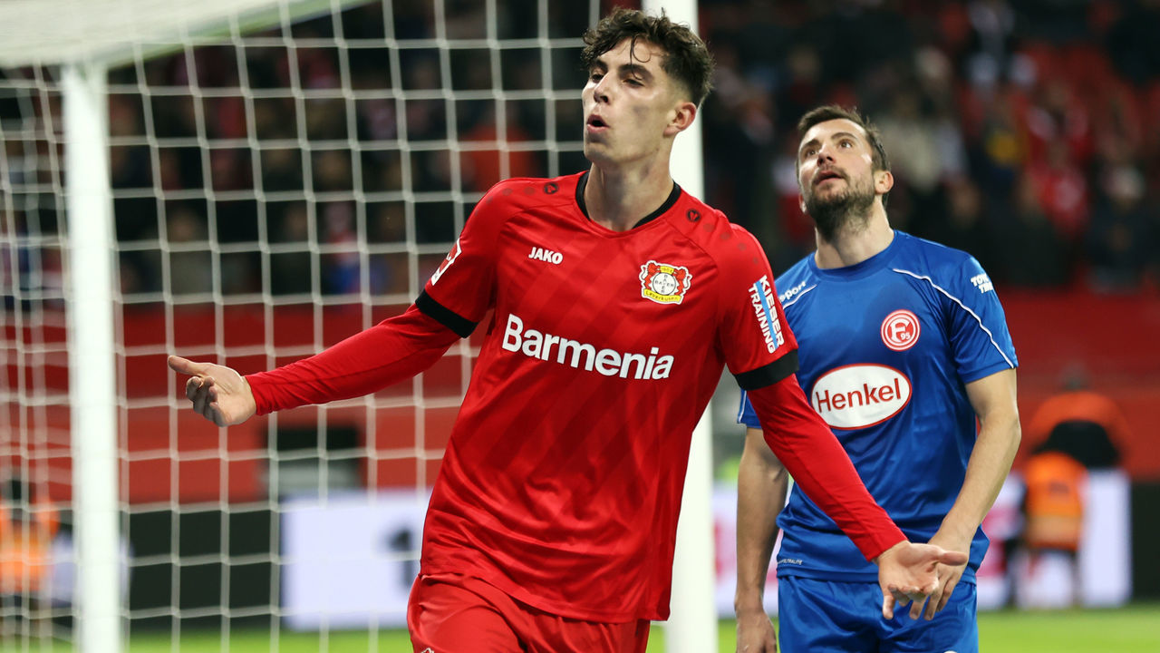 LEVERKUSEN, GERMANY - JANUARY 26: Kai Havertz of Leverkusen celebrates his team's first goal as Markus Suttner of Duesseldorf reacts during the Bundesliga match between Bayer 04 Leverkusen and Fortuna Duesseldorf at BayArena on January 26, 2020 in Leverkusen, Germany.